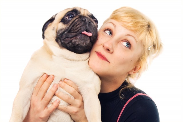 owner embracing her pug