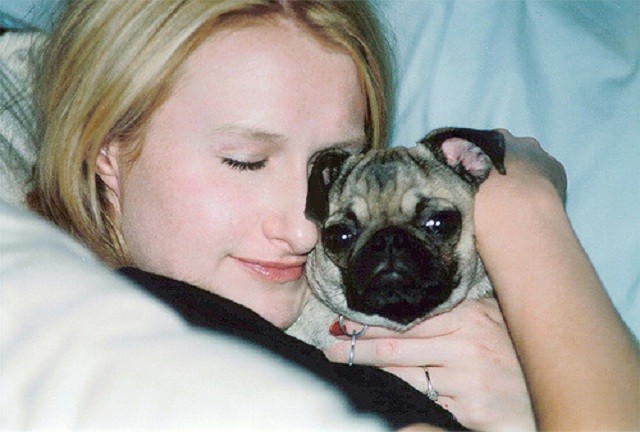 sleeping with a baby pug