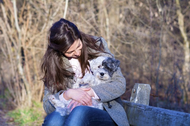 woman hugging her dog