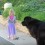 Loyal Newfoundland Dog Watches Over a Little Girl by the Pool