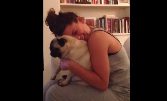 mom hugs her pug