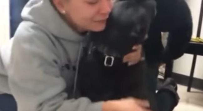 owner hugging her dog
