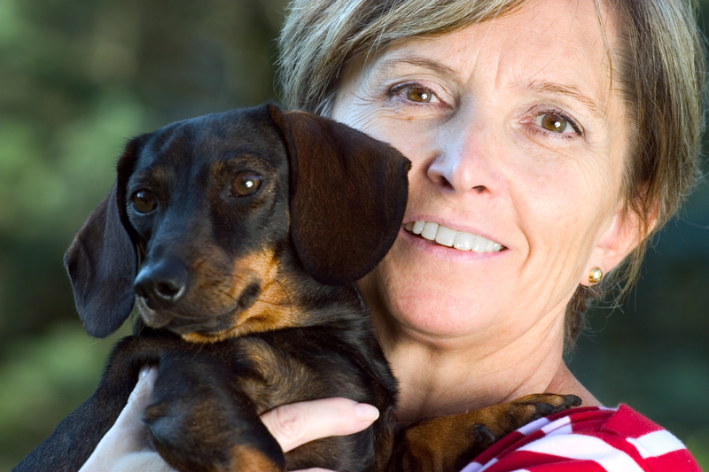 woman holding a doxie